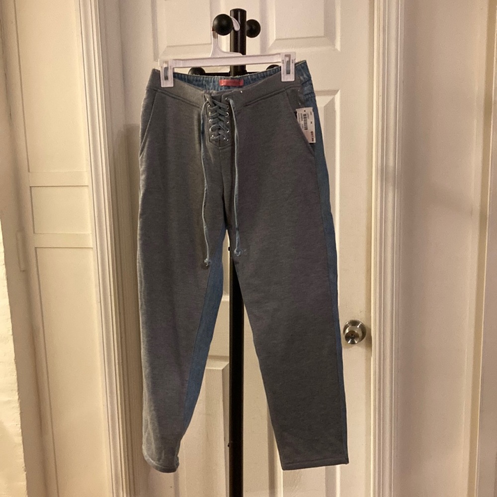 Size medium Blue jeans in the back sweat pants in the front.